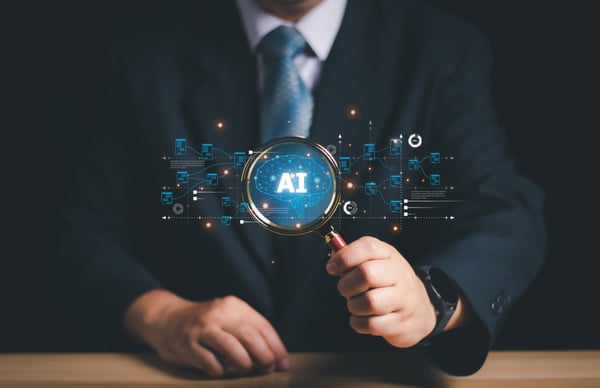 Magnifying glass being help my two hands showing AI