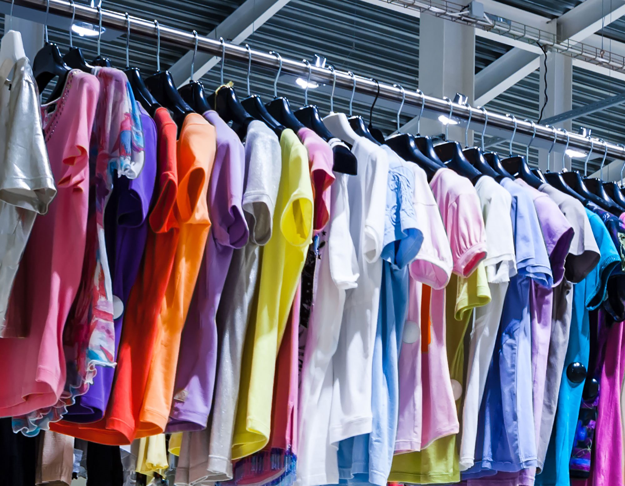 Clothing hanging in a warehouse