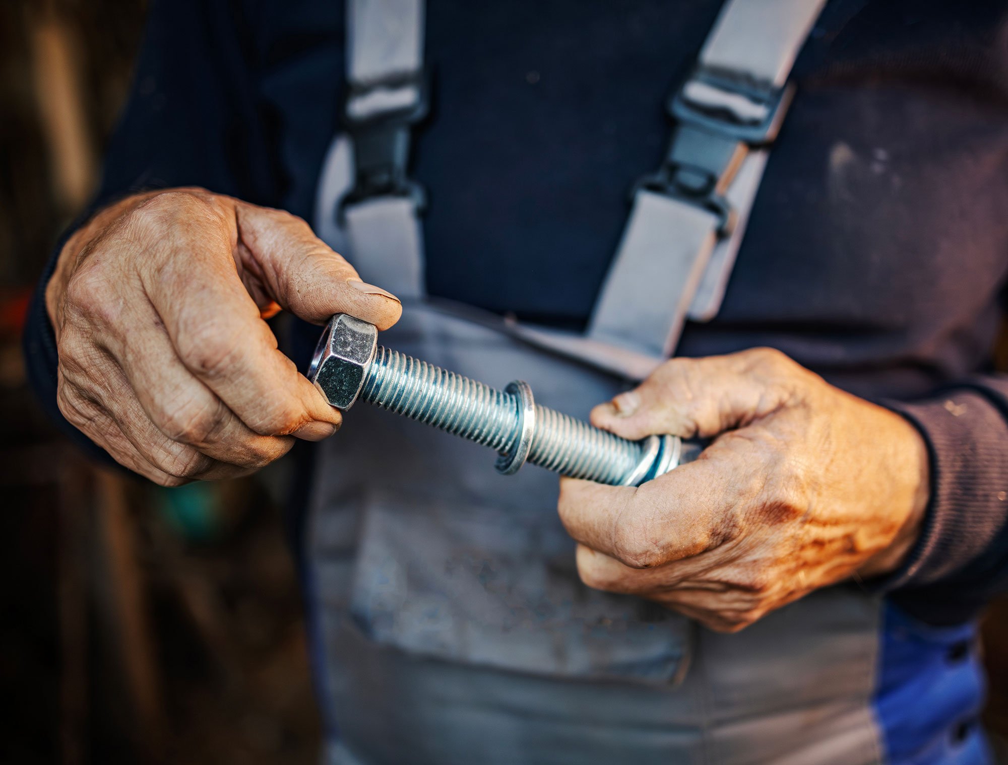 Man holding a large bolt
